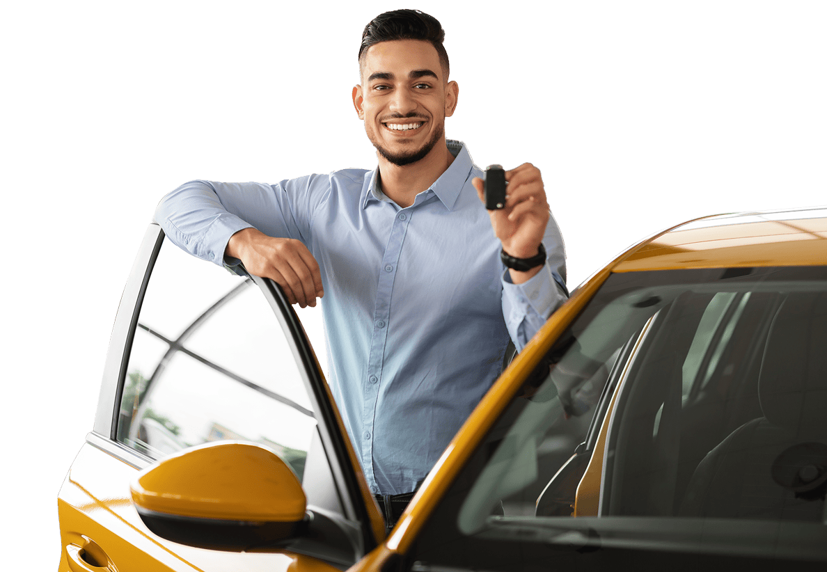 man standing outside of a yellow car with the door open and holding car keys while smiling